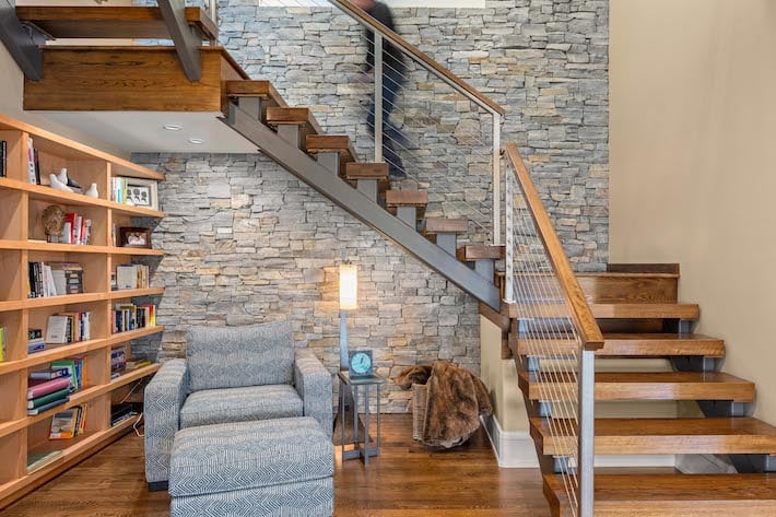 stairwell and library in spec home