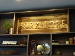 fork lore food and spirits sign