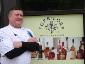 chef Chris standing in front of fork lore sign