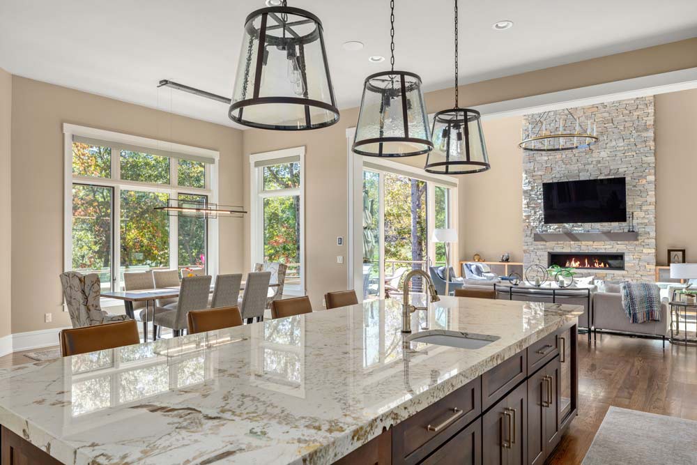 luxury kitchen and dining area with marble island