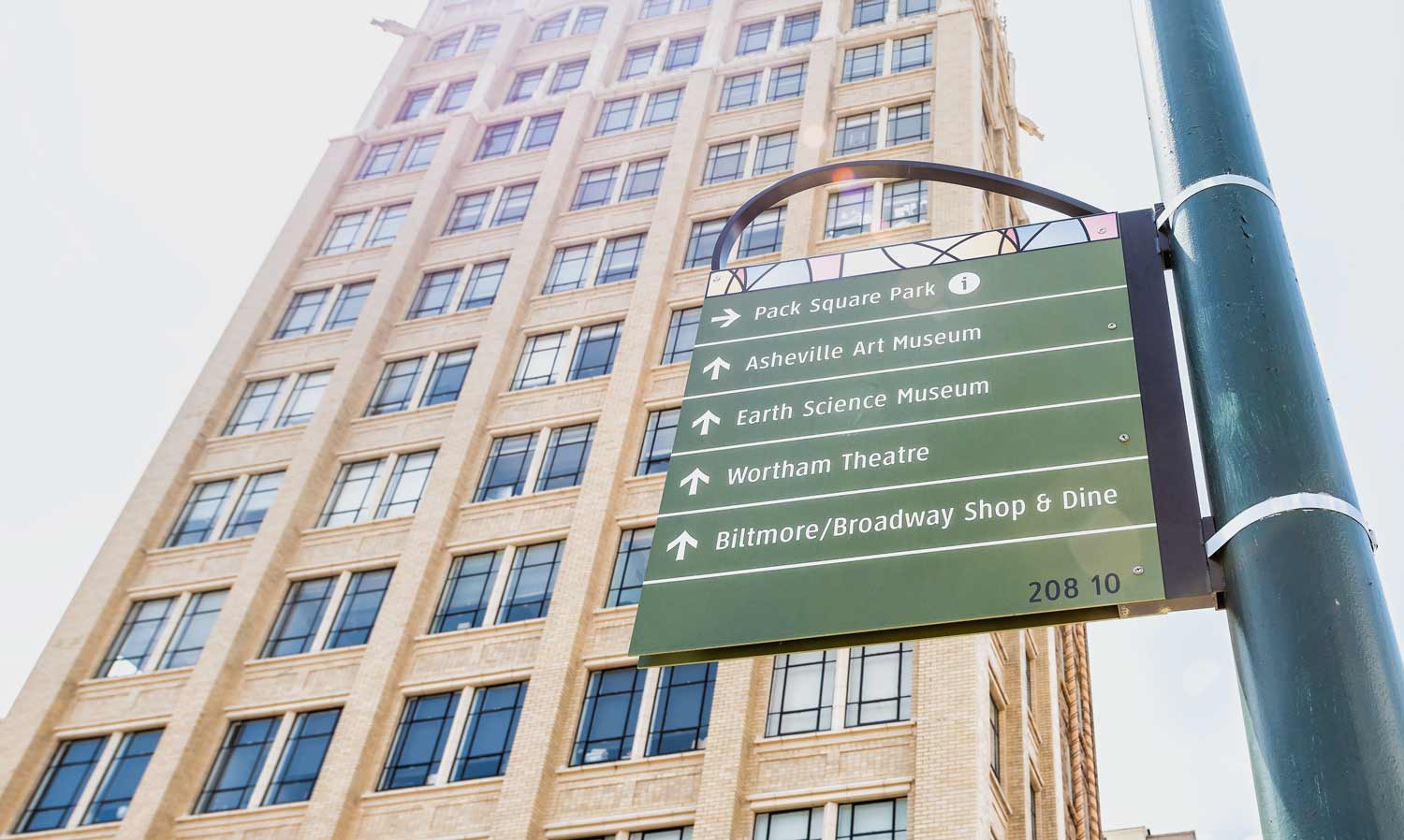 sign with downtown Asheville attractions