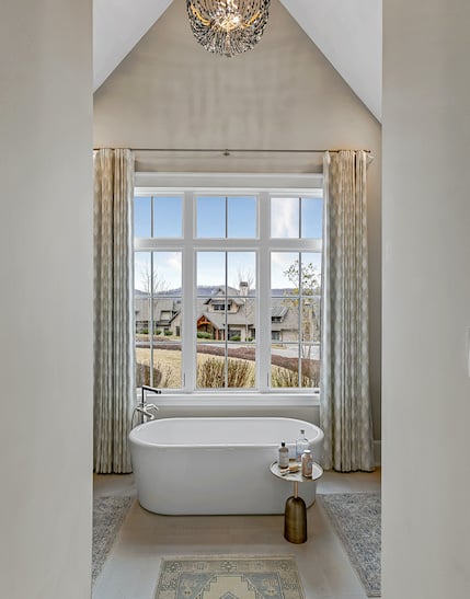 bathtub in front of window