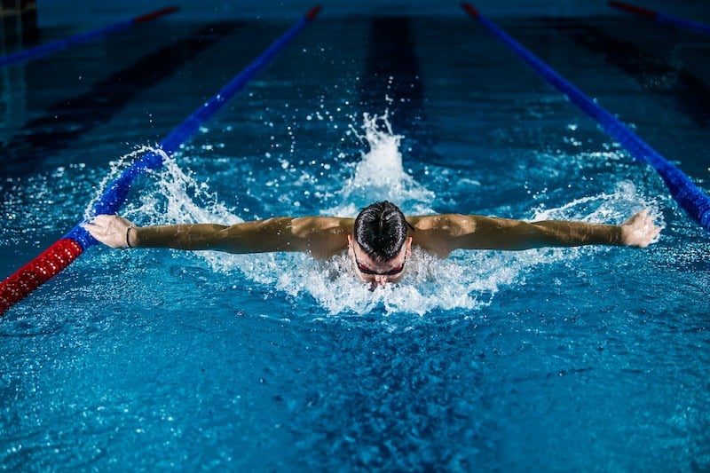 man swimming laps